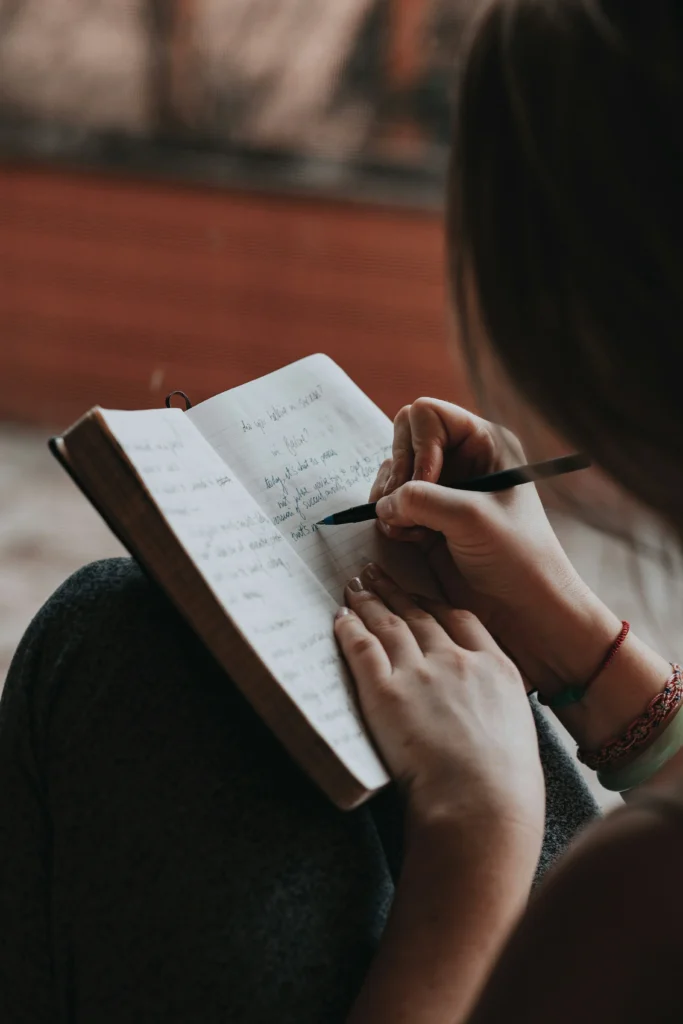 My Parents Are Divorcing: 5 Lessons That Helped Me Heal 3 A girl writing a diary. used on article My Parents Are Divorcing -5 Lessons That Helped Me Heal