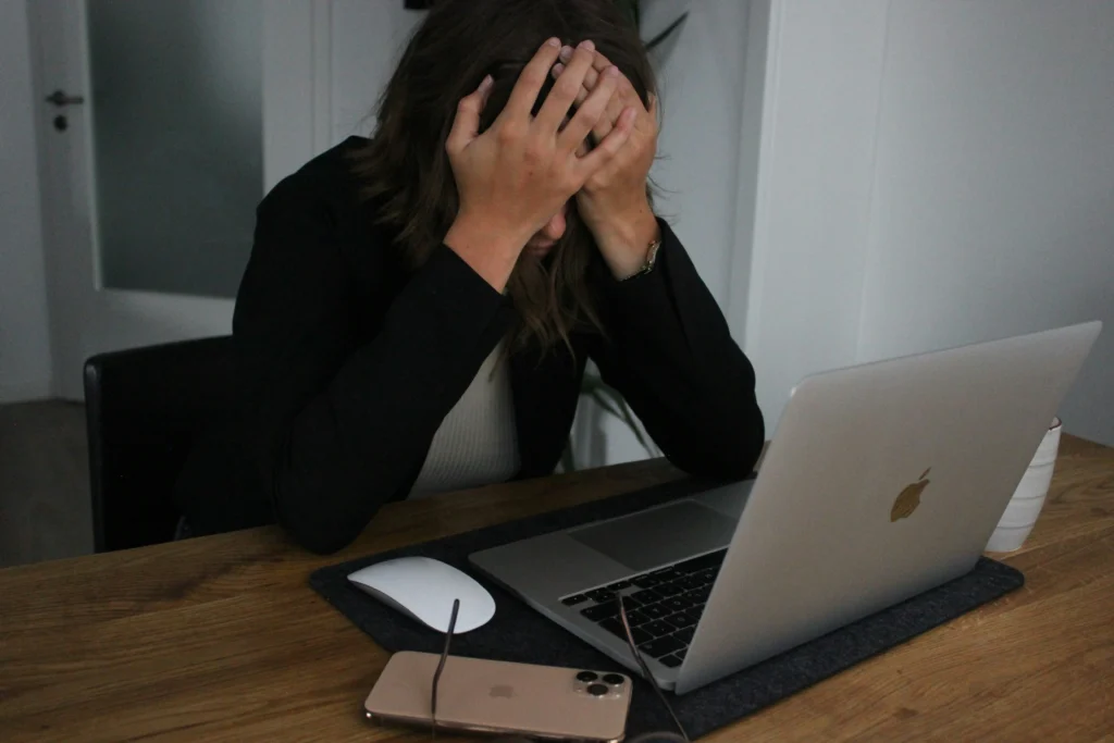 Coping with High-Functioning Anxiety - A Daily Struggle 2 A depress person on work table image on article Discover what it's like living with high-functioning anxiety. Learn its signs, real-life experiences, and strategies to manage anxiety while staying productive.