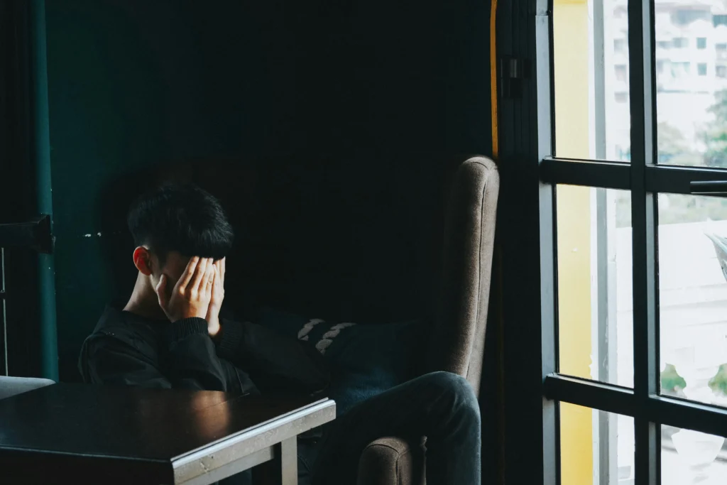Coping with High-Functioning Anxiety - A Daily Struggle 3 a sad man mage on article Discover what it's like living with high-functioning anxiety. Learn its signs, real-life experiences, and strategies to manage anxiety while staying productive.